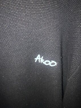 3 AKOO sweaters with akoo pins